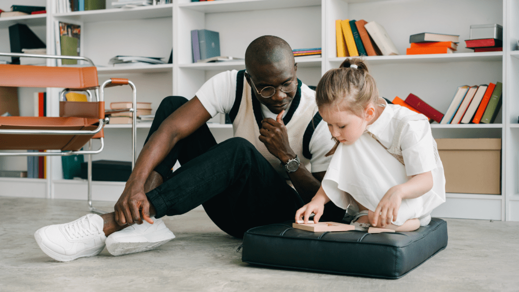 a person and a young person sitting at a table