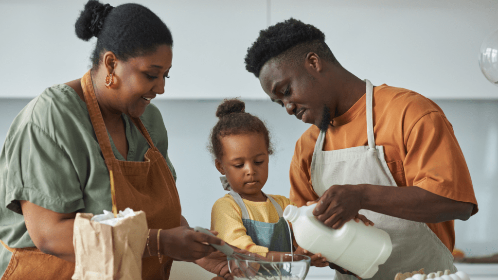 A father and daughter baking bread together