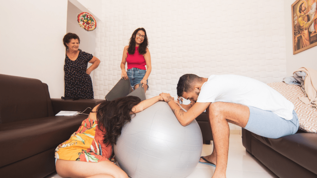 A person in a bathroom with an exercise ball