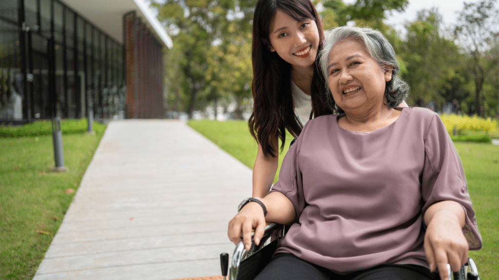 A person in wheelchair talking to nurse