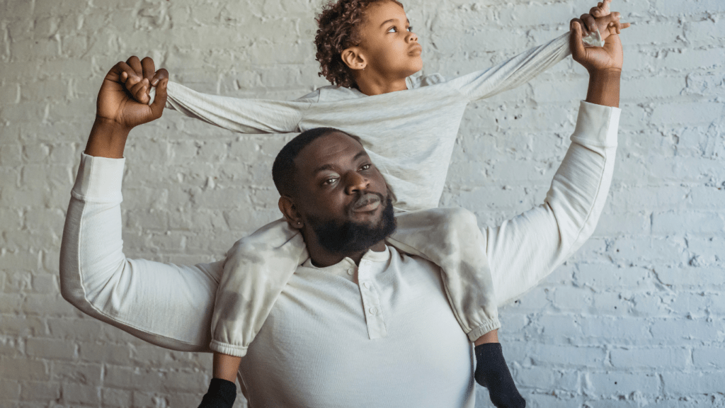 A man holding his son on his shoulders