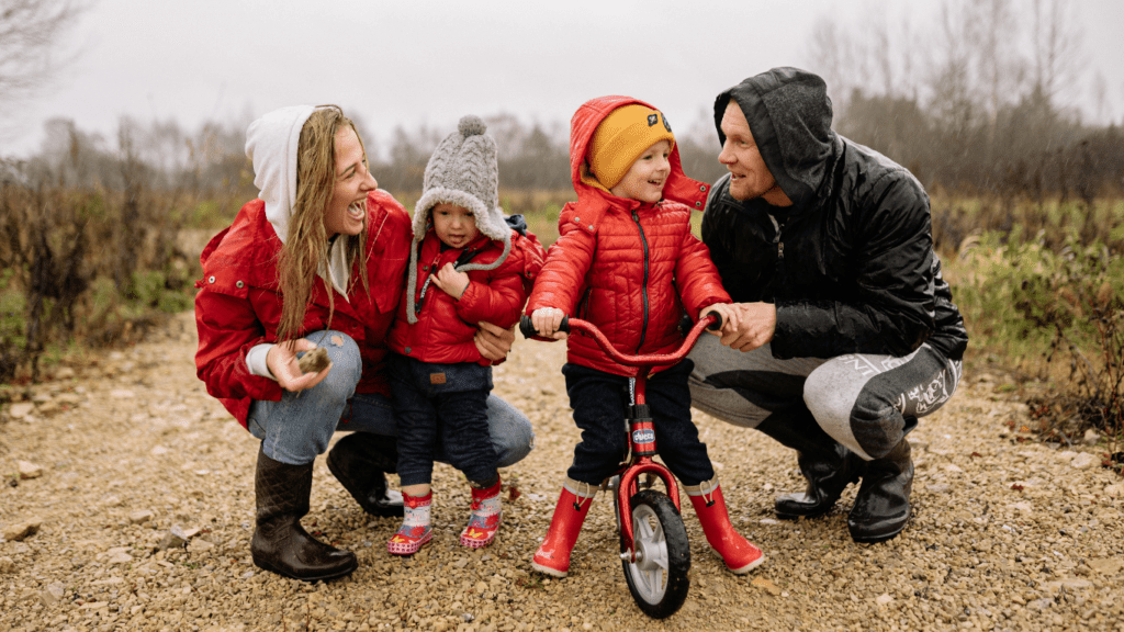 image of a happy family playing in the park