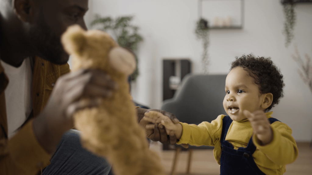 a person playing with a baby