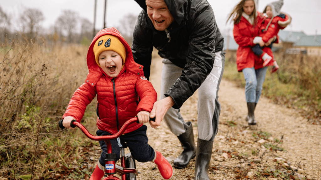 a person and a child riding a bike