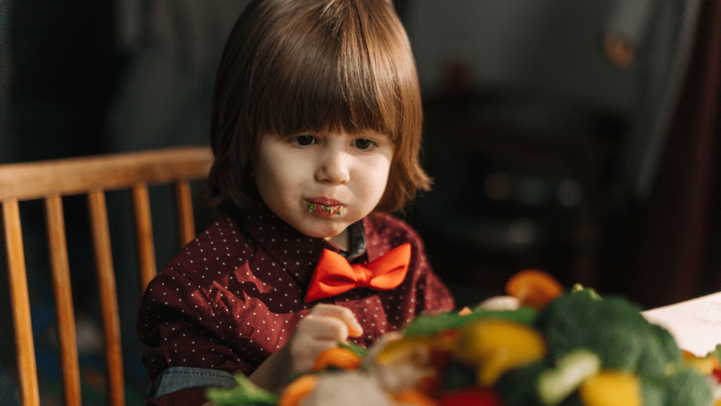 a child eating a vegetables