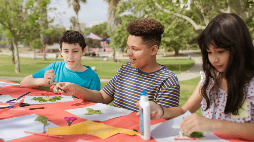 a group of children working on crafts at a table