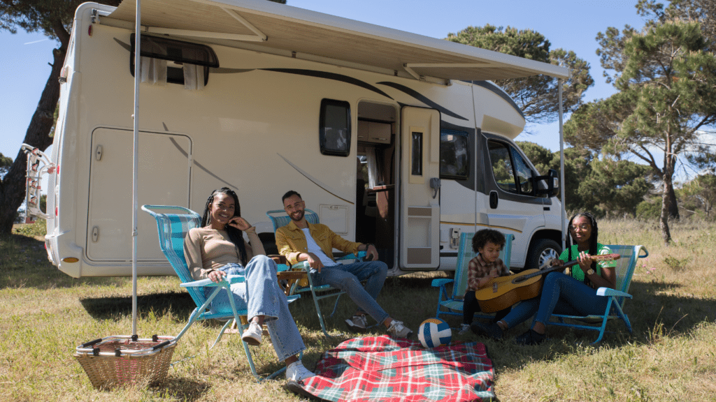 a group of people sitting on chairs in front of an rv