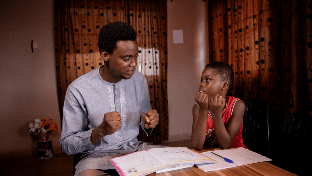 a parent and child are reading a book together