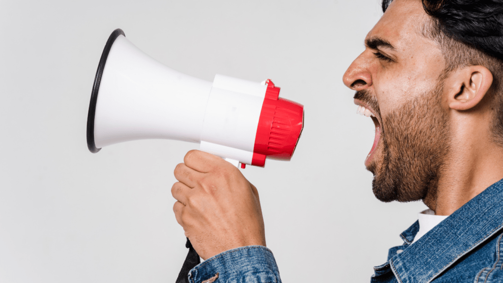 a person is yelling in front of a window