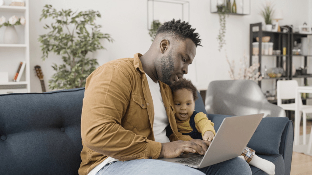 a person playing with a baby