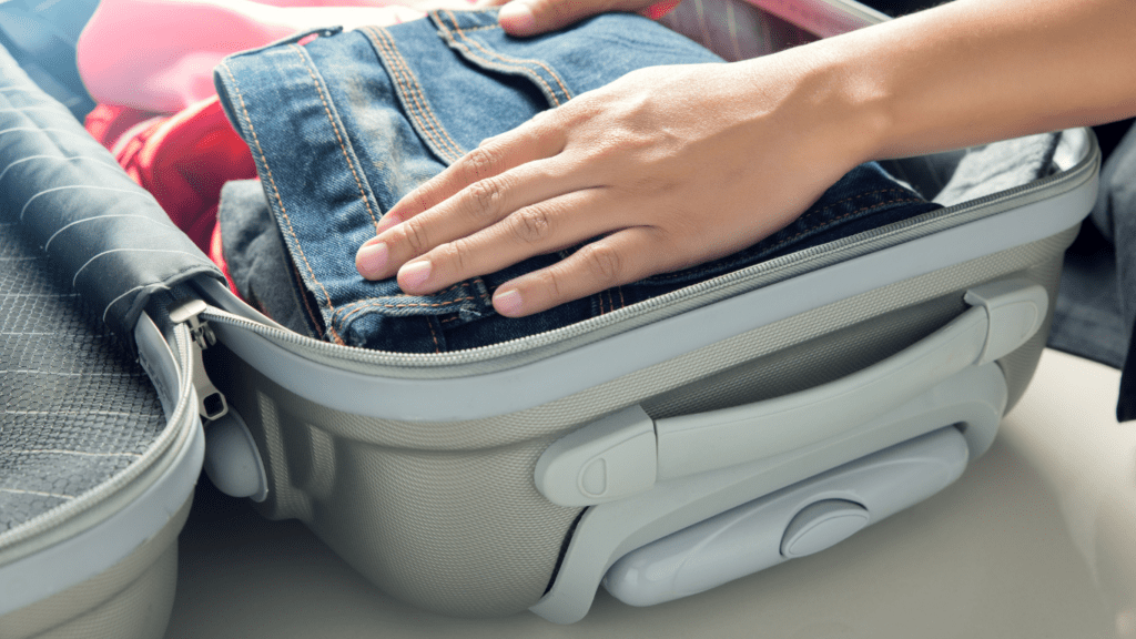 an open suitcase filled with clothing and accessories