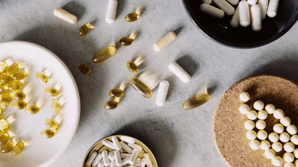 many different types of pills and capsules in a plastic container